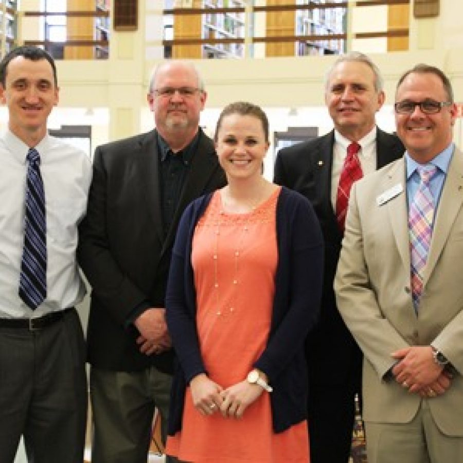 Lindbergh High School English teacher Katie Arens celebrates her district Teacher of the Year honor with, from left, LHS Principal Eric Cochran, Board of Education member Mike Tsichlis, Superintendent Jim Simpson and Assistant Superintendent Brian McKenney.