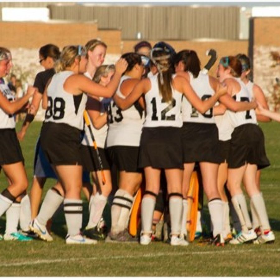 Oakville field hockey players celebrate a tournament victory last year.