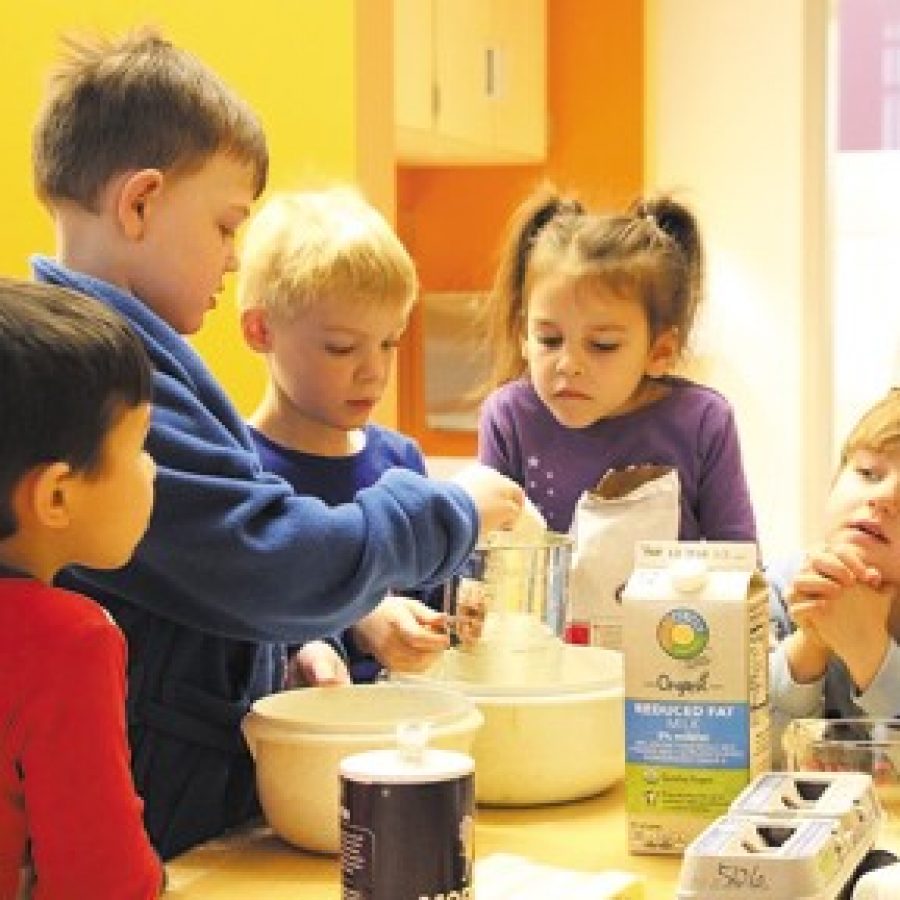 Students in Teresa Darrs Caterpillar class make their pancakes during their tasty, hands-on learning experience.