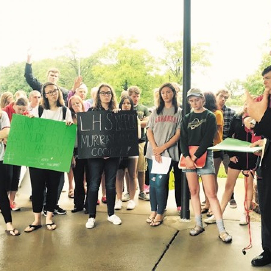 Lindbergh Superintendent Jim Simpson, right, talks to Lindbergh High School students and alumni who staged a sit-in at Central Office on the last day of school Friday until Simpson accepted their 800-signature petition that calls, among other things, for a tax-rate increase to fund higher teacher salaries. Earlier in the week, the students walked out of school in protest.