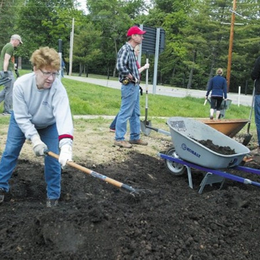 Elise Mullins, of south county, volunteers at the Grants View librarys new garden.
