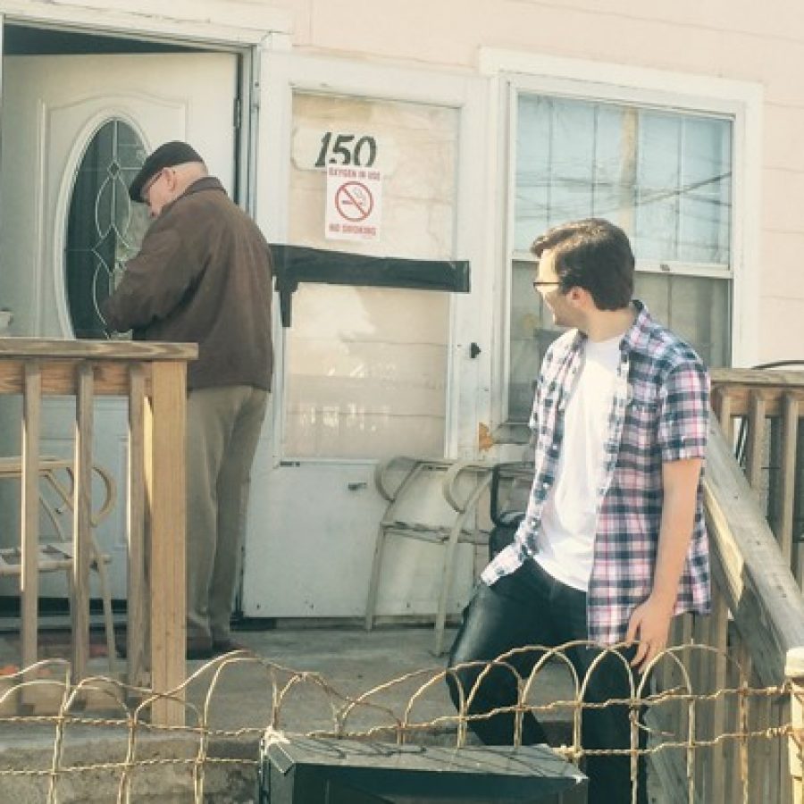 Hancock High School senior Timothy Walden, right, and Rep. Bob Burns, D-Affton, deliver Meals on Wheels to a senior citizen in Lemay on Good Friday, when regular volunteers were unavailable.