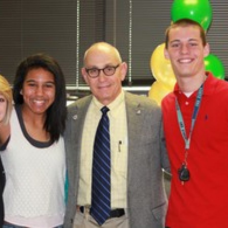 Lindbergh High School students, from left, Jordan Ward, Leah Dents and Chuck Houska celebrate with Principal Ron Helms, who was named Educator of the Year by the St. Louis Association for Secondary School Principals. 