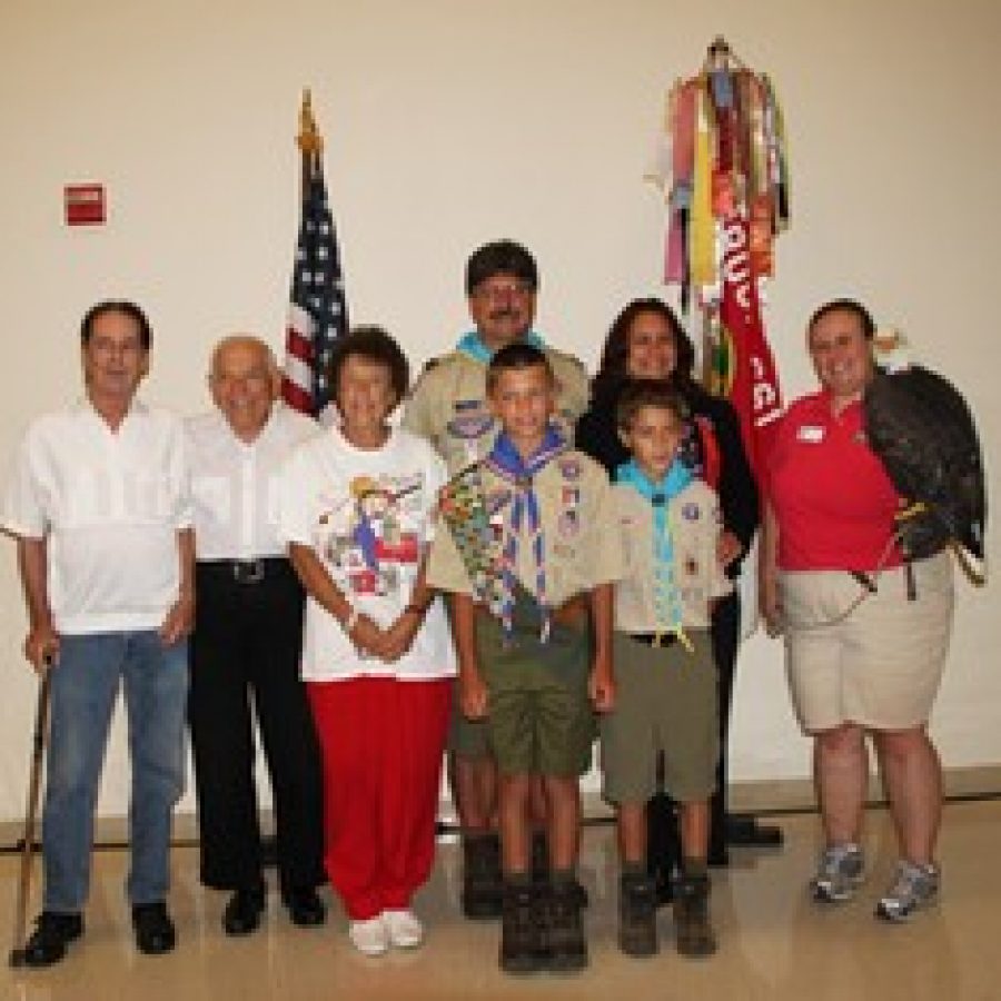 At Nicholas Davis Eagle Court of Honor ceremony, from left, are: grandparents James Mask and Raymond and Janette Davis; parents Timothy and Lisa Davis; Nicholas; brother Christopher Davis; and Cathy Spahn, with an eagle from the World Bird Sanctuary. 