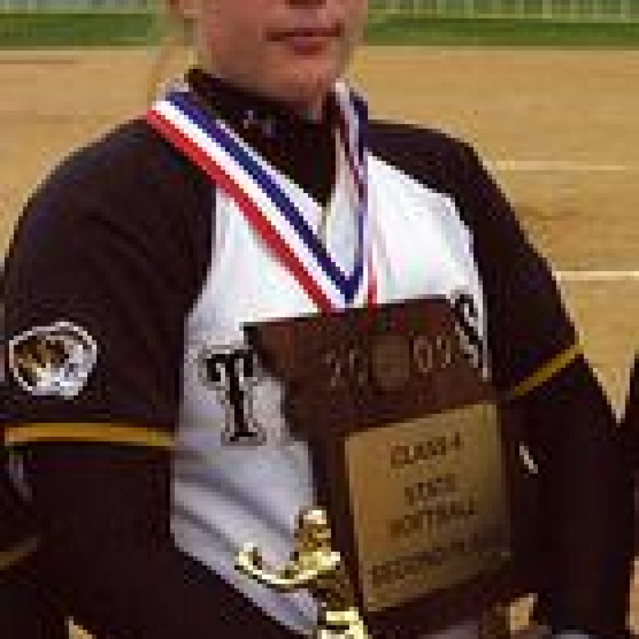 Oakville senior catcher Maggie Ruckenbrod stands proudly clutching the trophy for taking second place in the Missouri Class 4 State Softball Championships at St. Joseph Heritage Park. Bill Milligan photo 