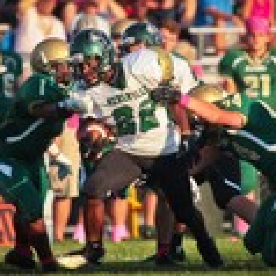 Mehlville running back Tradell Cunningham, No. 22, plows through the Lindbergh defense during a Mondays game at Lindbergh High School. Photo by Brandon Benefield
 