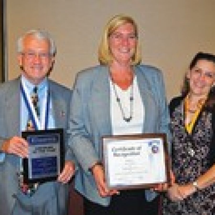 Truman Middle School teacher Lisa Marin, right, is recognized as a member of the Arnold W. Zimmerman Society by the Crestwood-Sunset Hills Kiwanis Foundation during the clubs 50th anniversary celebration. She is pictured with Kiwanian of the Year Brent Stewart, left, and Kiwanis Rookie of the Year Terri Varble, center. 