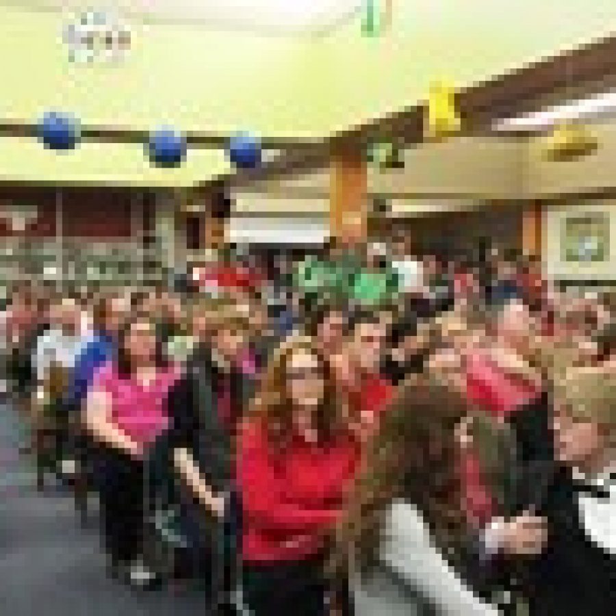 A sea of teachers and students wearing red in support of the districts teaching staff stood out in the crowd of roughly 400 when the board met Wednesday night in the Mehlville High School Library for a first look at the list of cuts. Photo by Gloria Lloyd 