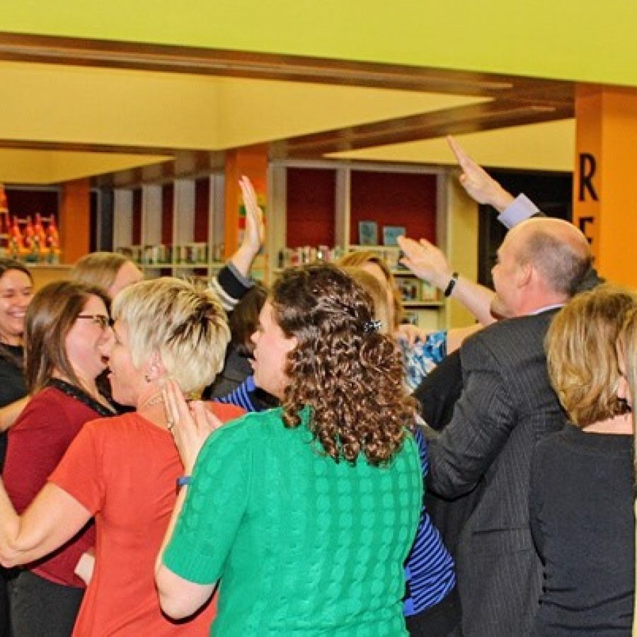 Teachers for the new Mehlville school of innovation celebrate with Forder Elementary School Principal Scott Clark after the Board of Education approved it last week.