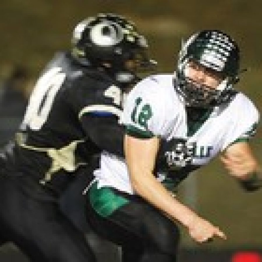 The Mehlville Senior High School football team defeated the Oakville Tigers 28-25 Friday night in the first round of the Class 6 District 1 playoffs. In their last meeting Oct. 11, the Tigers prevailed over Mehlville in a 35-23 comeback victory. Above, Oakvilles Qian Johnson, left, is all over Mehlville quarterback Brendan Moore.