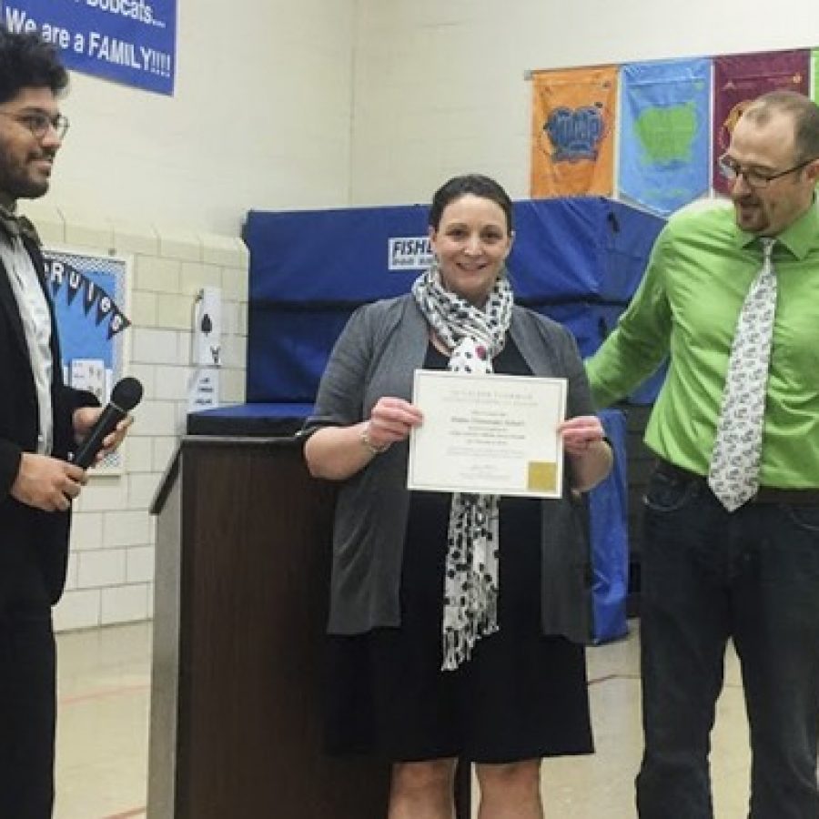 Blades Elementary School was honored Friday as the 10,000th affiliate school nationwide of the Gilder Lehrman Institute of American History, which provides free resources to improve the teaching of American history in schools. English-Language Learner teacher Jamie Williams wrote an essay to nominate the school in December. At the ceremony, from left, are: Daniel Pecoraro of the Gilder Lehrman Institute, Williams and Blades Elementary Principal Jeremy Booker.