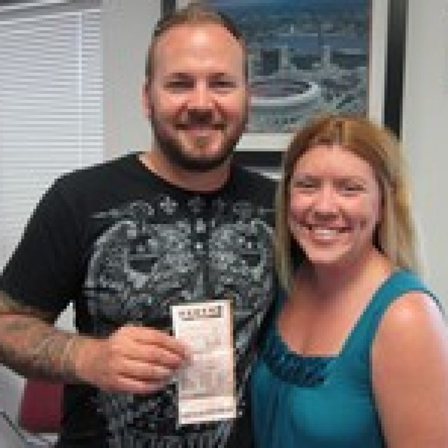 Pictured are lottery winner Christopher Henson and his fiancée, Amy Cendroski. They won \$1 million in a Powerball game. 