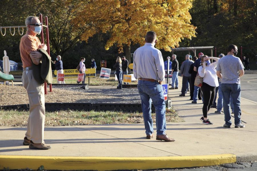 Voters line up to vote at Rogers Elementary in Oakville Tuesday, Nov. 3, 2020.