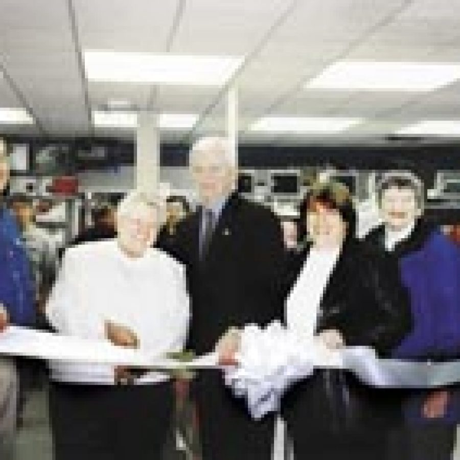 Computer Renaissance had its grand reopening and ribbon cutting on Jan. 10. Helping Jim Russel cut their ribbon from left to right are: Sr. Irene Cline, Notre Dame High School; Major Jim Robertson; Diana Lineberger, Coldwell Banker Gundaker; Pat Duwe, Alderman of Crestwood; and Karen Provance, Crestwood Chamber of Commerce.