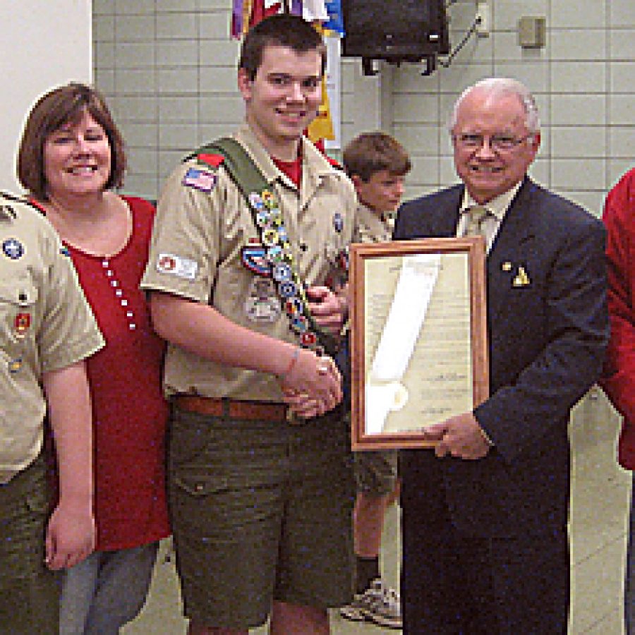 Rep. Walt Bivins presents an Eagle Scout resolution to John Patrick Carman at Washington Middle School. Pictured, from left, are: Nick Carman, Linda Carman, John, Bivins and Rick Carman.