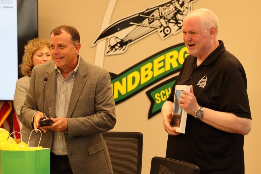 Lindbergh Superintendent Tony Lake (left) presents former Board Director Mike Tsichlis with a plaque commemorating his time on the board.