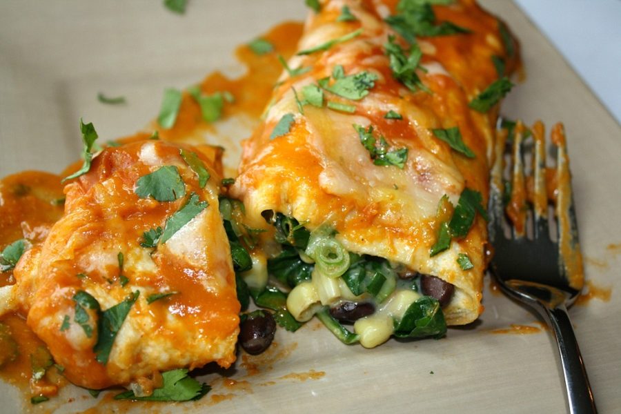 Lettuce and sour cream top these spinach enchiladas.