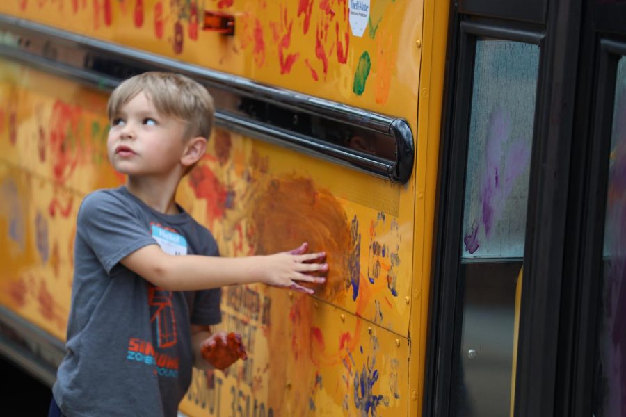 Crestwood Elementary kindergartners paint the bus