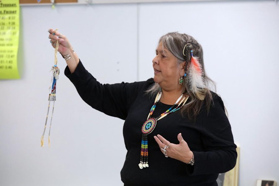 Katherine Dickerson, also known as KiowaKat, gives a presentation on Kiowa culture at Hancock Place Middle School Nov. 22. 