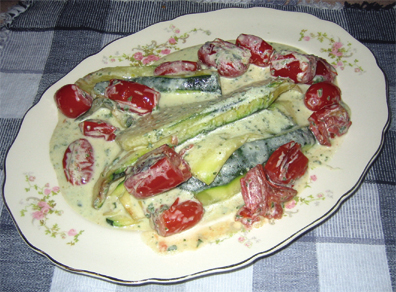 Tomatoes, zucchini and cream sauce make the taste of this side dish.