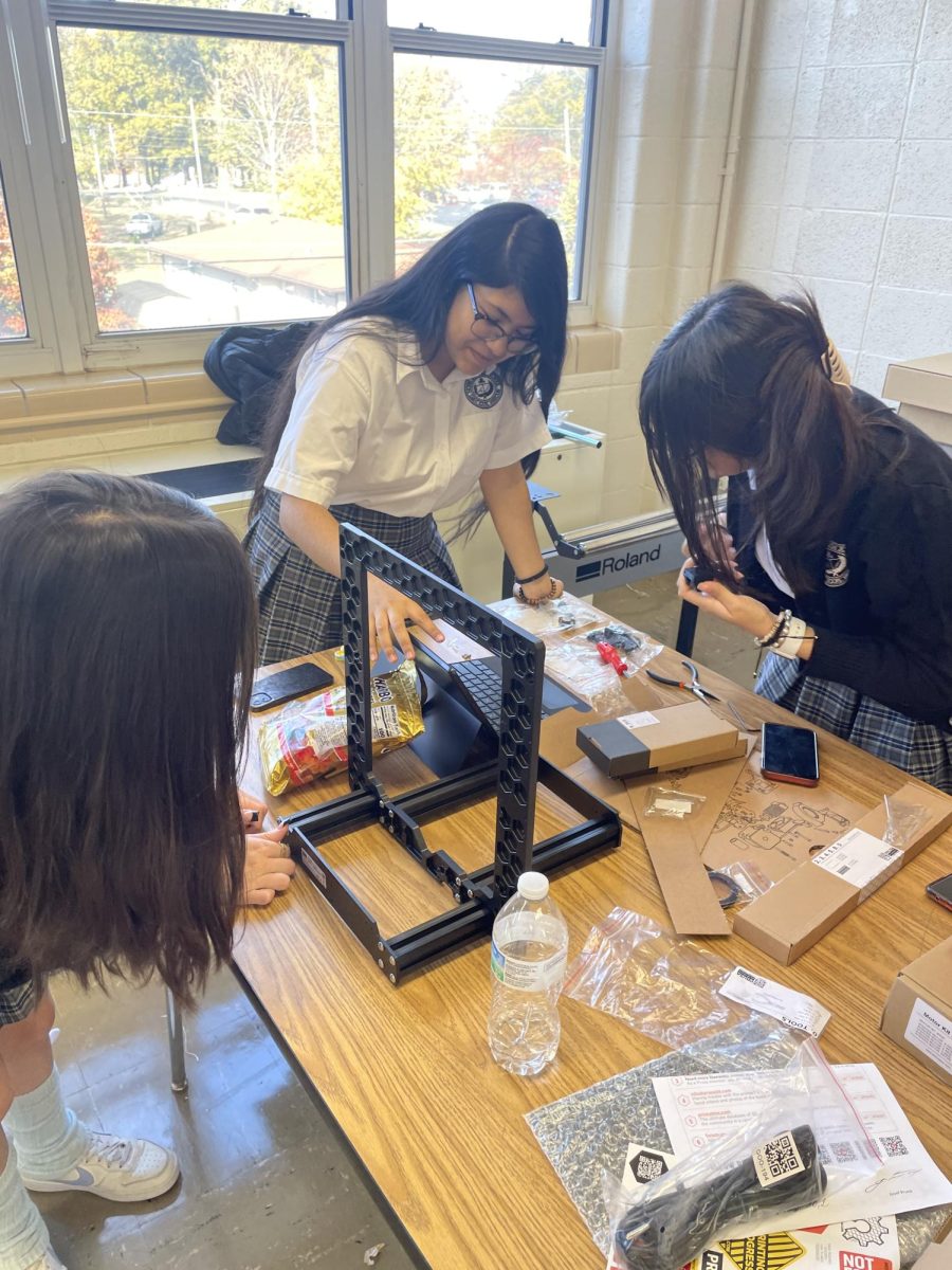 Notre Dame High School freshmen Yasmin Amezcua, Leilani Cruz and Karla Batres assemble a 3D printer for the new fab lab. Photo taken and provided by David Brosch. 