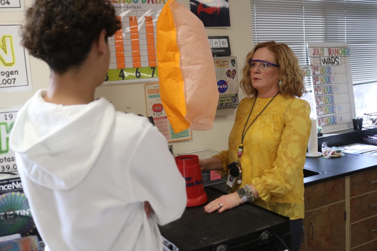Cassie Trueman helps one of her students make adjustments to their hot balloon last Thursday. Photo courtesy of the Mehlville School District. 