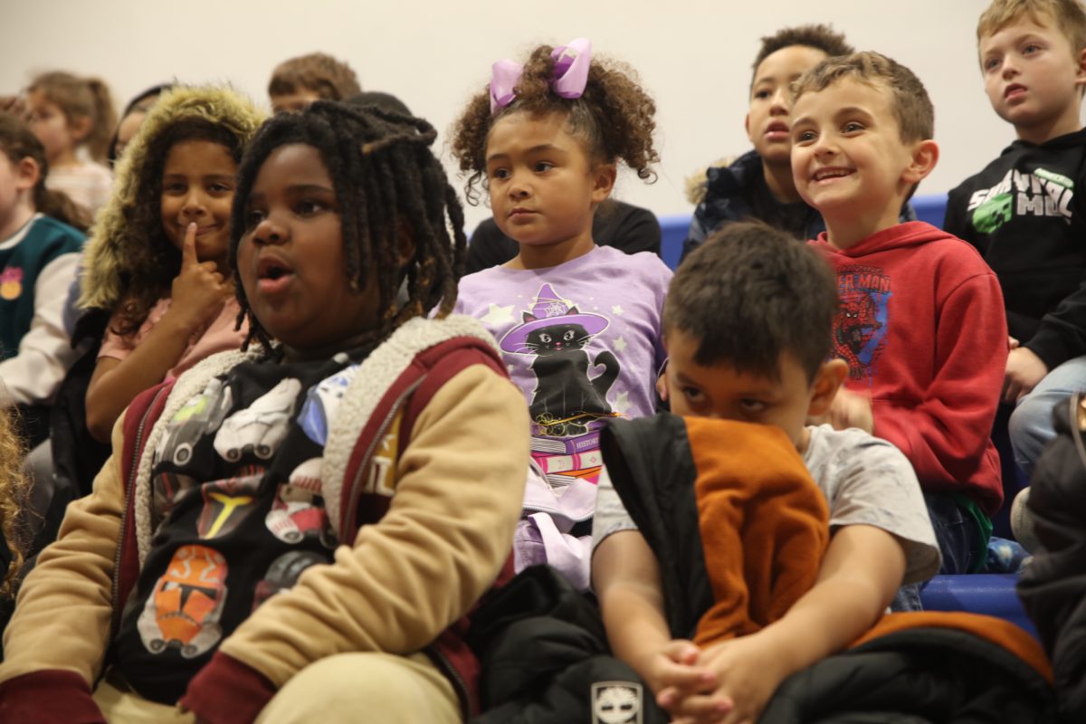 Students react to the bike reveal.