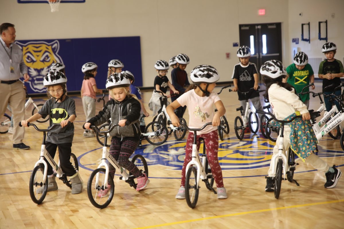 Students begin trying out new bikes.