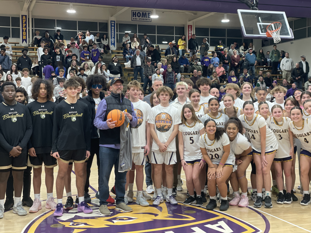 Timothy Smith with the Affton boys and girls basketball teams, as well as the Bayless boys basketball team, on Dec. 13.