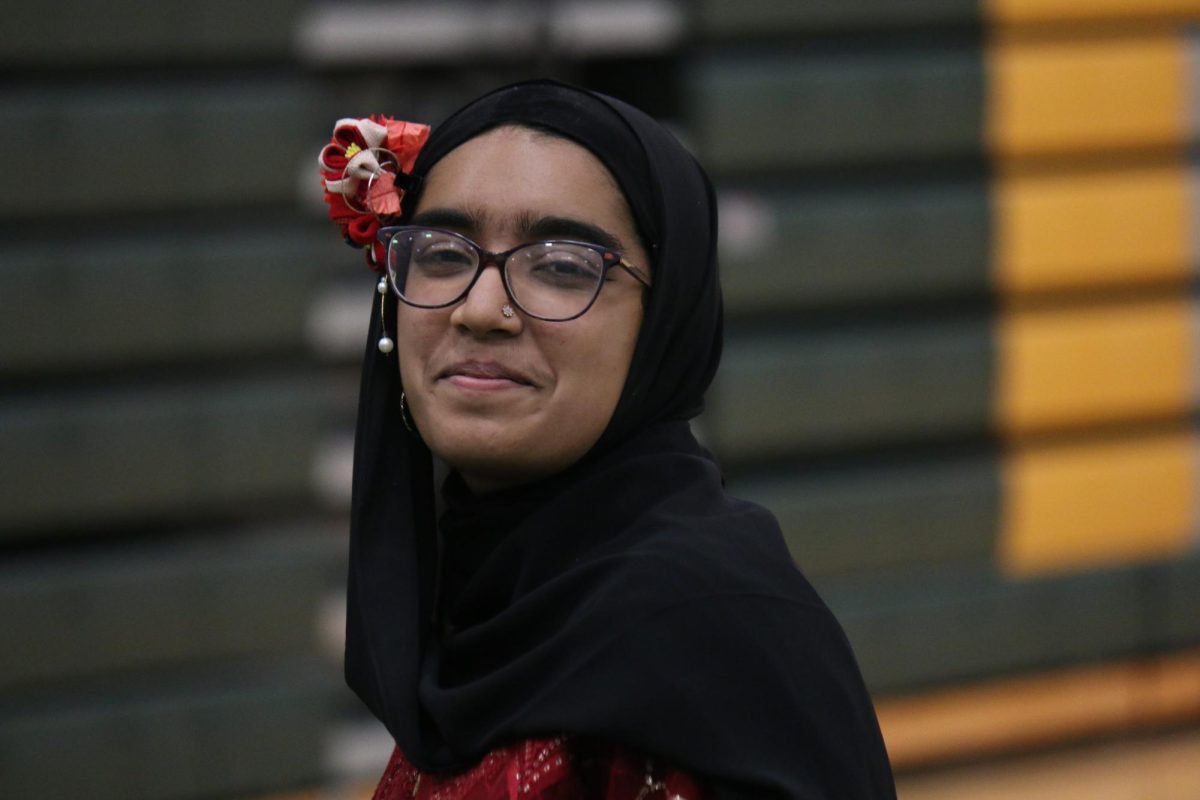 Lindbergh High School senior and International Week Organizer Safiya Hasan smiles at the camera over her shoulder.