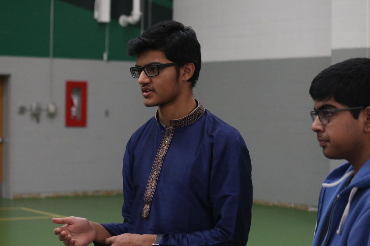 Representing India – specifically the Telugu language – Lindbergh High School senior Vidur Kother teaches the Five Pillars of Islam to attendees.