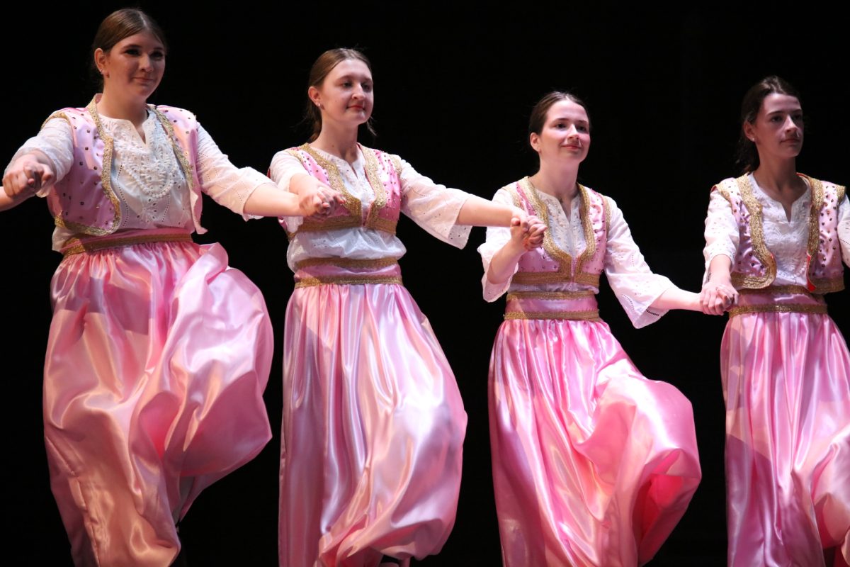 As part of the folk dance, the Bosnian performers jump.