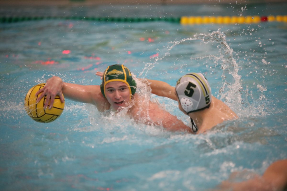 A Lindbergh player with possession tries to escape a Sycamore defender. 