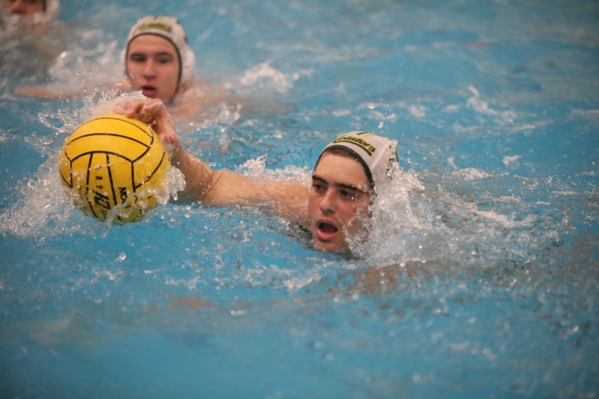 A Sycamore player gets possession from a teammate.
