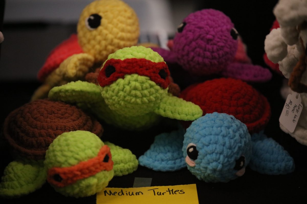 Handmade crocheted turtle plushes are stacked for sale at the Crestwood-Sunset Hills Rotary Club's spring 2025 “Arts and Crafts Fair."