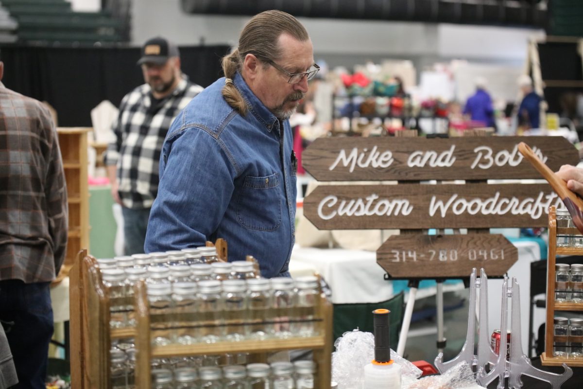 A vendor surveys his station at the Crestwood-Sunset Hills Rotary Club's spring 2025 “Arts and Crafts Fair." 