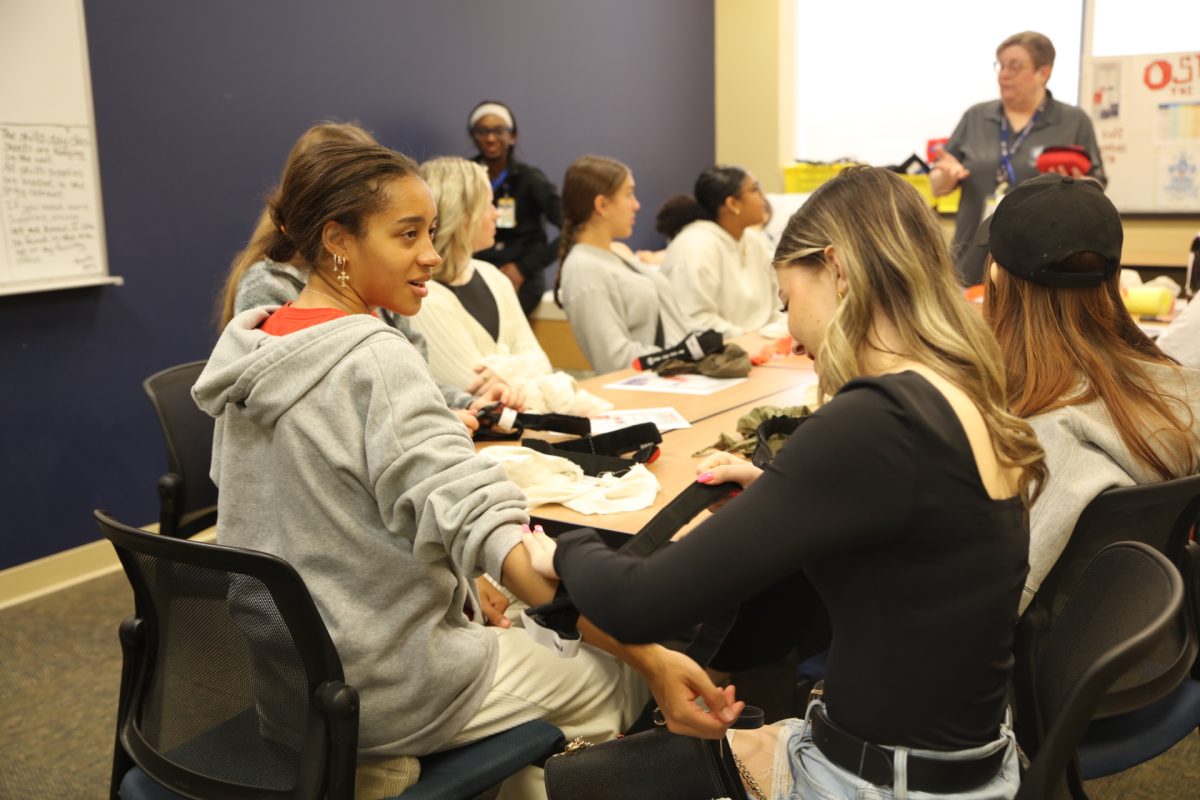 Students practice applying tourniquets.