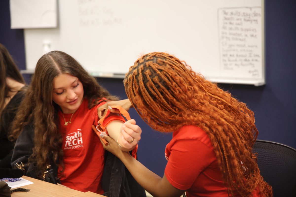 Students practice applying tourniquets.