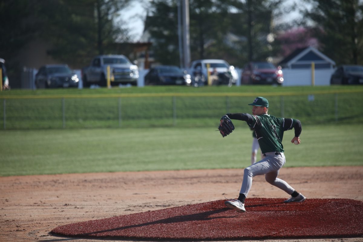 Mehlville's pitcher winds up.