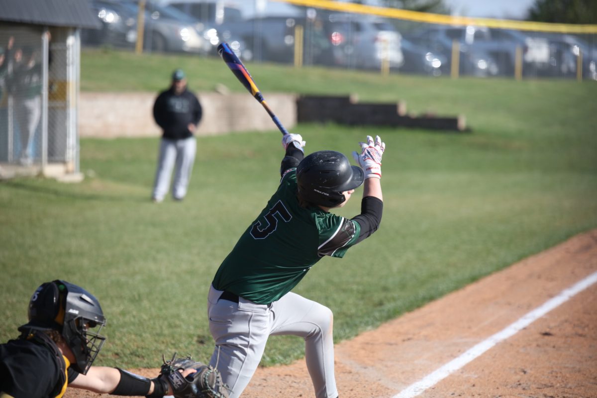 A Mehlville better swings at an oncoming pitch.