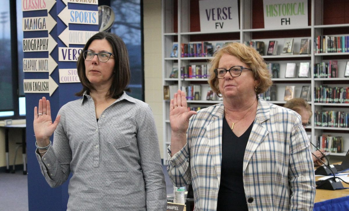 Serene Wilkinson, left, and Ann Zimpfer take their oath of office at the Mehlville Board of Education's April 10 meeting. Photo courtesy of the Mehlville School District.