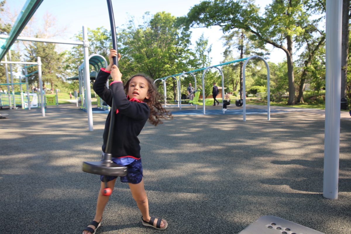 Crestwood Ward 4 Alderwoman Megan Gadallah's daughter Mila jumps off of a swing.
