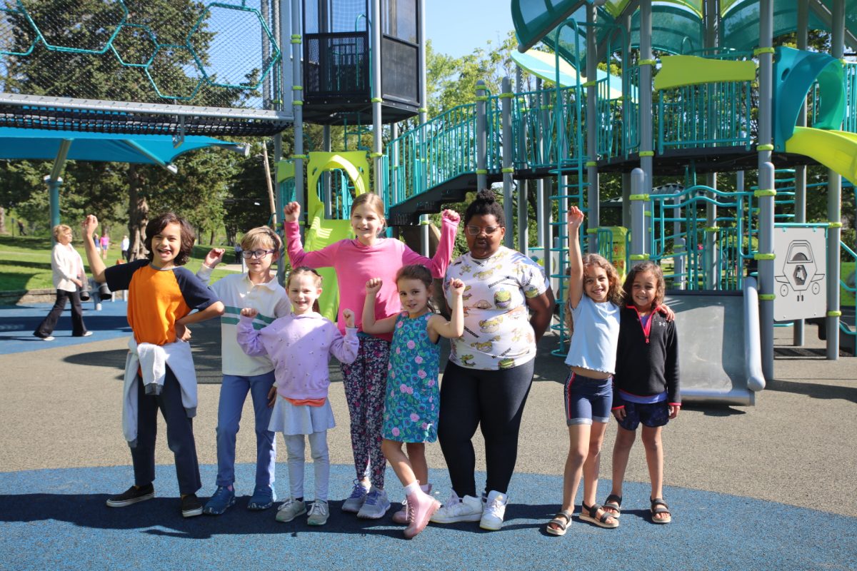 Students from Long Elementary School cheer for the new playgrounds.