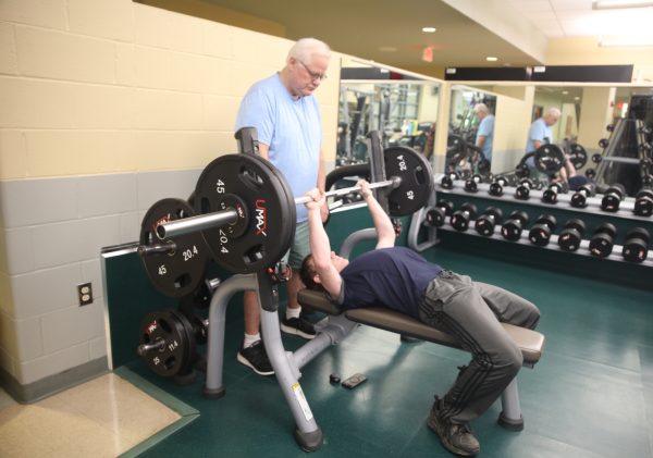 Arnold native Kaleb Calvert beats bench pressing world record