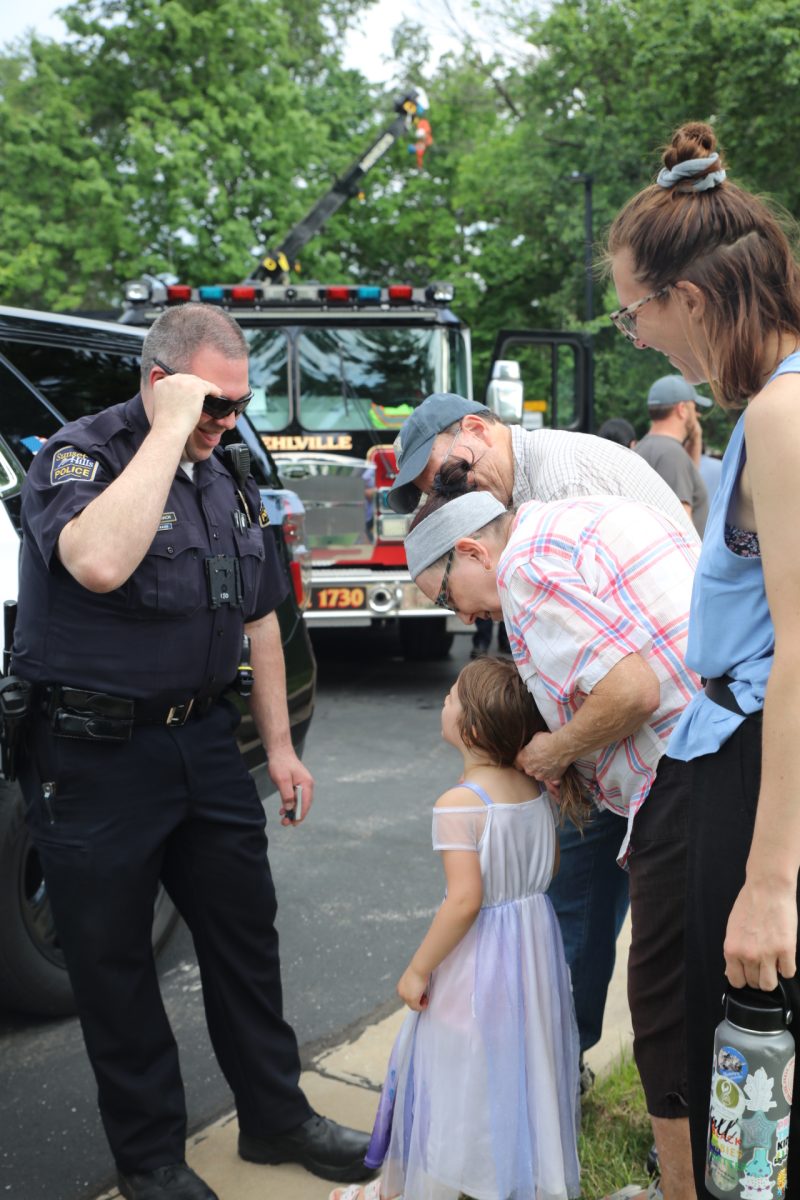 Attendees talk to the first responders present.
