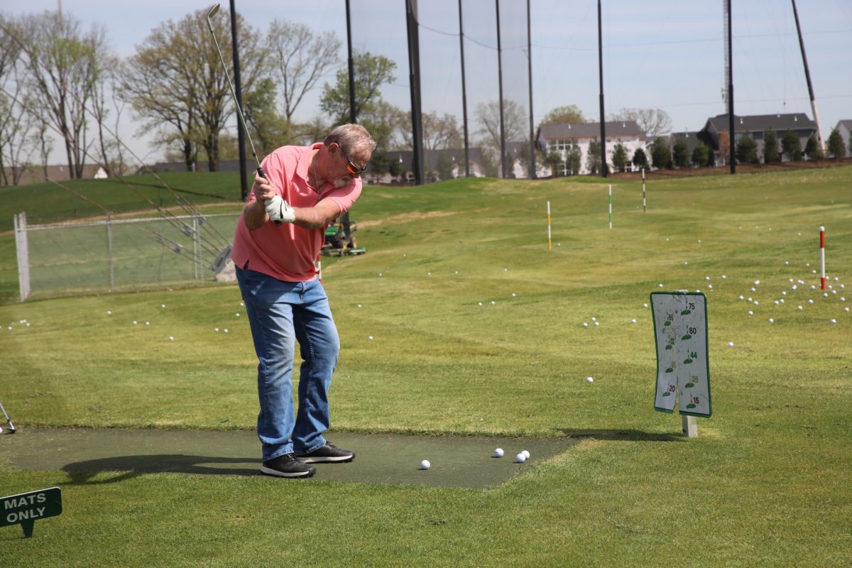 A veteran practices his swing at the April 23 clinic.