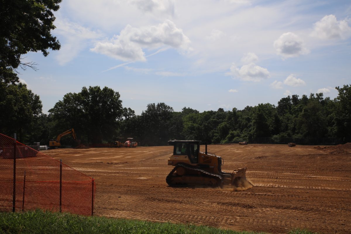 A bulldozer pushes dirt out of the way at the site of the new Crestwood Community Center, 9245 Whitecliff Park Lane.