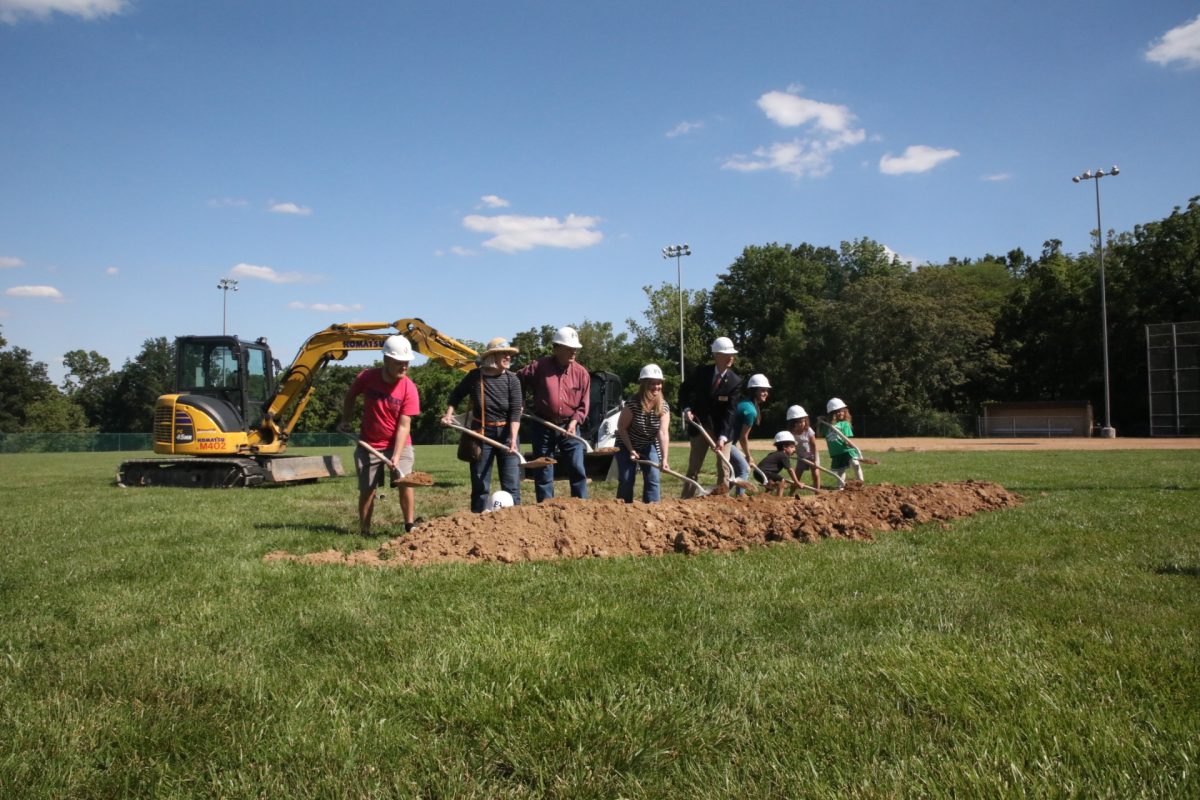 Mayor Scott Shipley (middle) breaks ground at the new Crestwood Community Center site with community members and elected officials om May 23.
