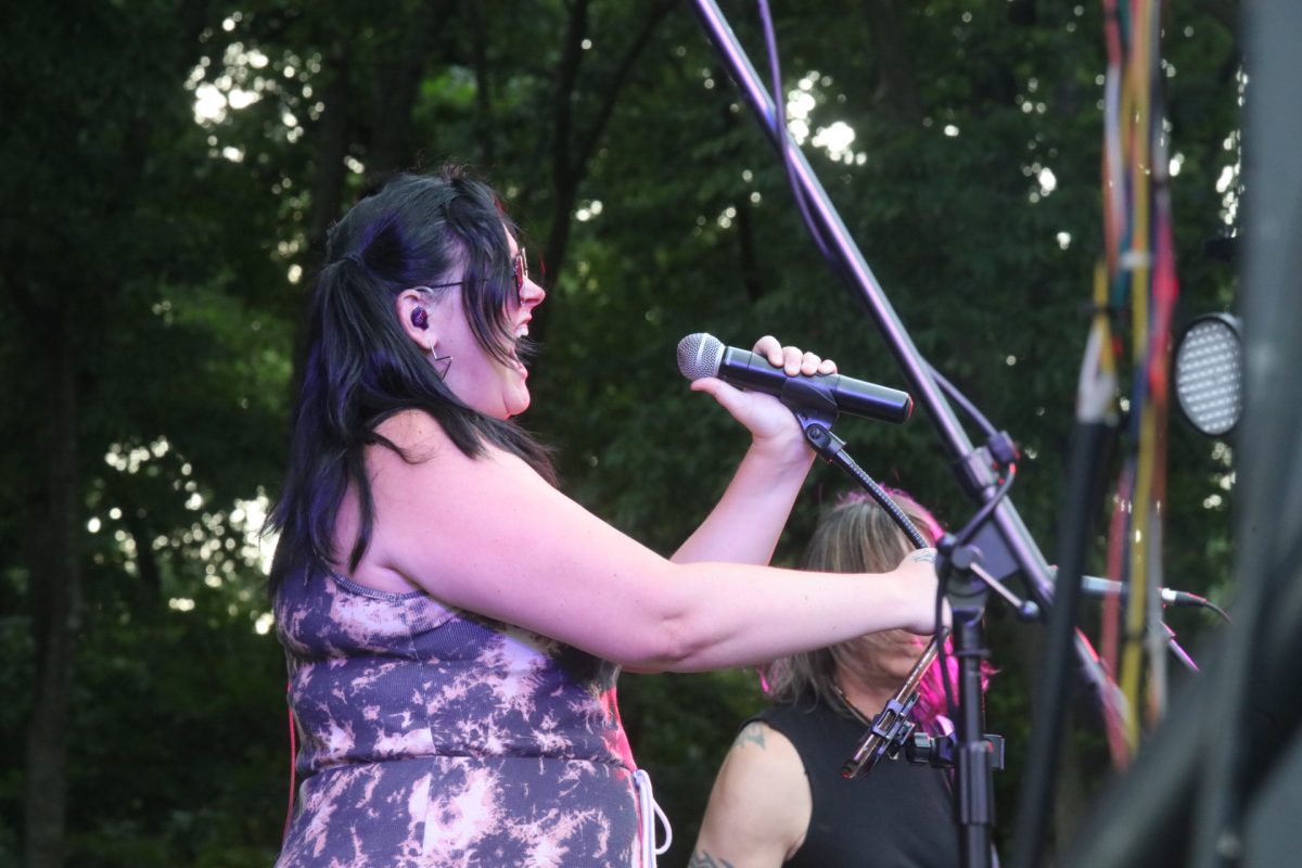 Real Rock Revival’s lead singer belts on stage.