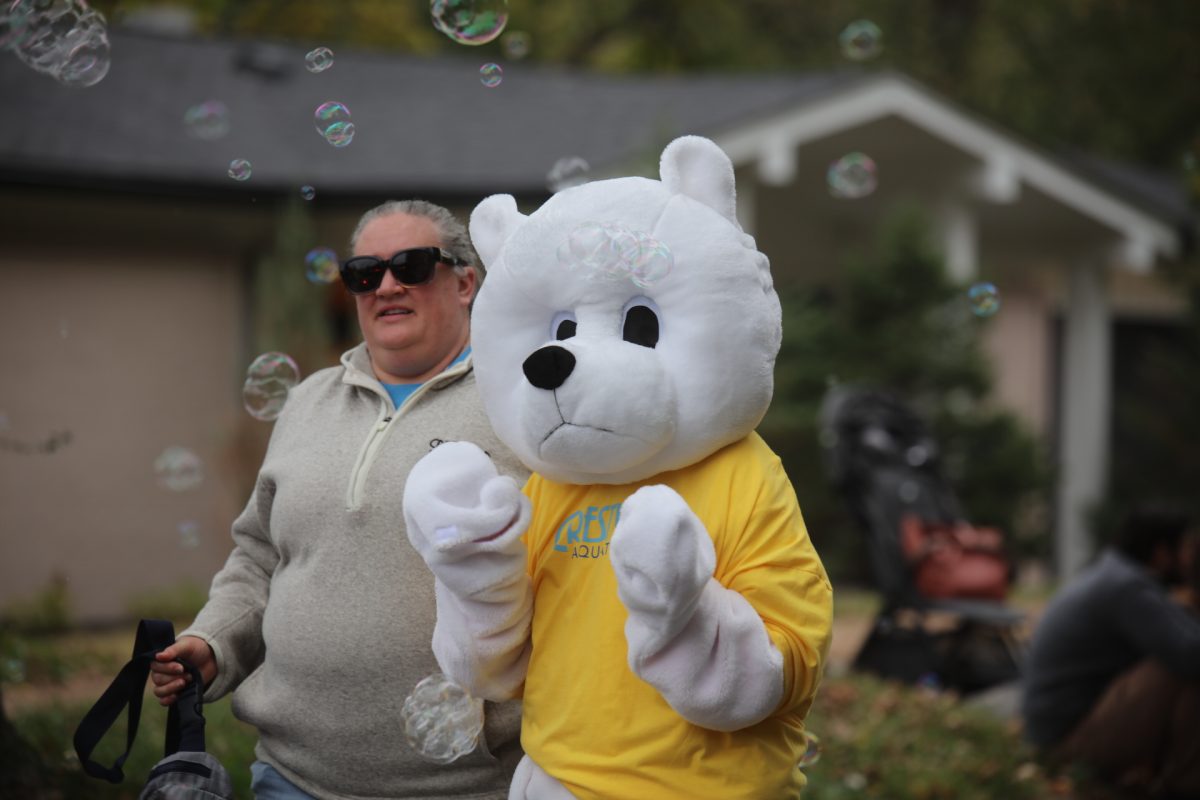 Cliff the bear — Crestwood's mascot — walked in the SunCrest Fest parade with bubbles bursting around him.